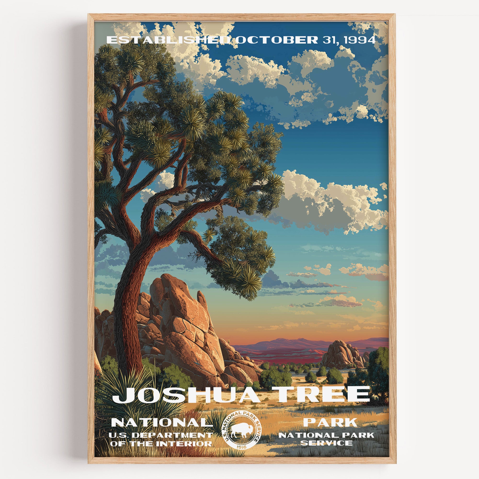 Joshua Tree National Park vintage travel poster in a wood frame, a Joshua tree and granite boulders against a sunset desert