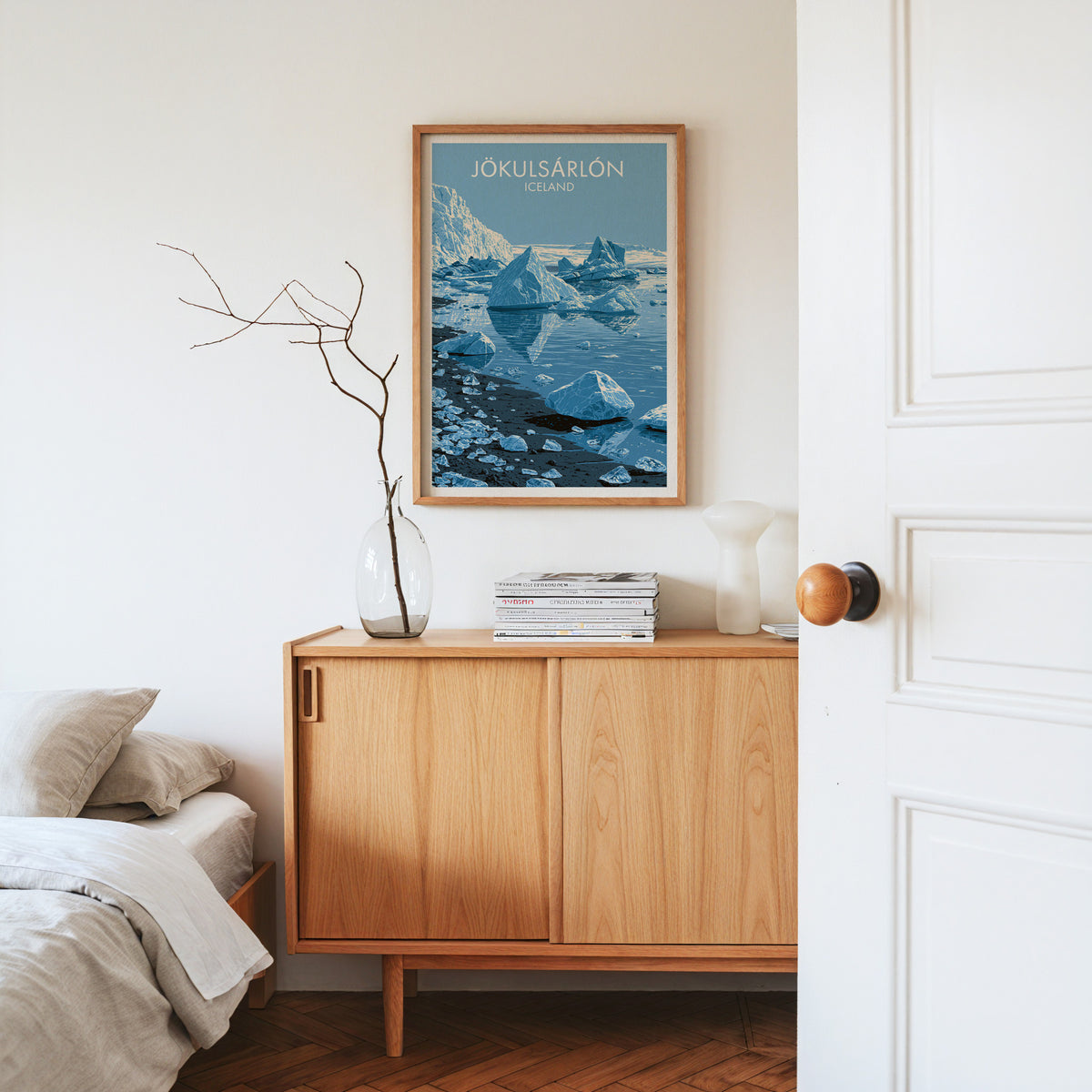 Jokulsarlon icebergs print, oak frame above a light oak sideboard with branches in a glass vase