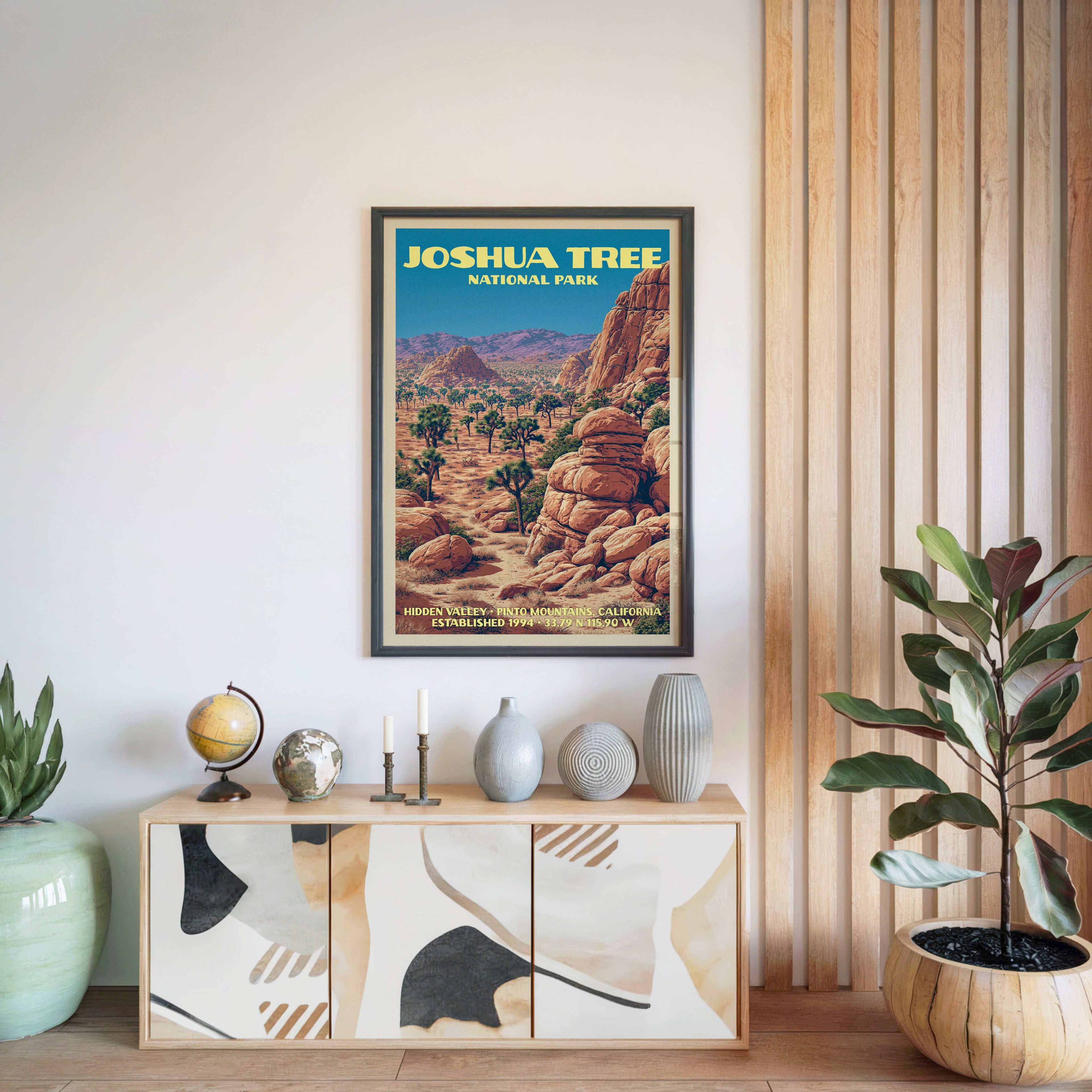 Joshua Tree National Park poster in a black frame above a light wood sideboard by a slatted wall panel