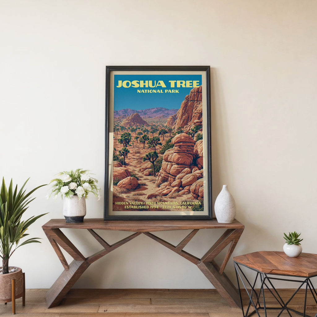 Joshua Tree Hidden Valley wall art in black, leaning on a walnut console with white anemones and a vase