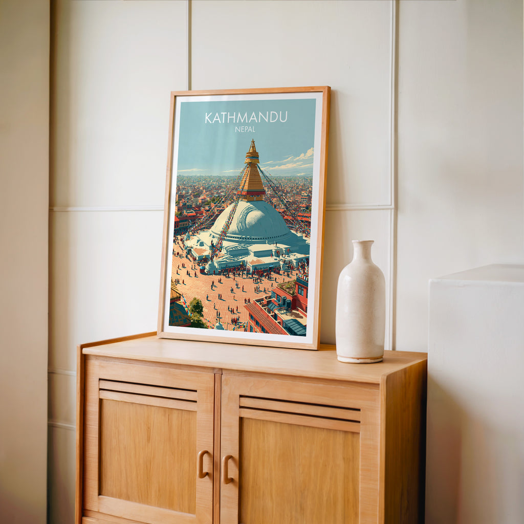 Small Kathmandu Nepal travel poster in an oak frame on a mid-century sideboard with a ceramic vase