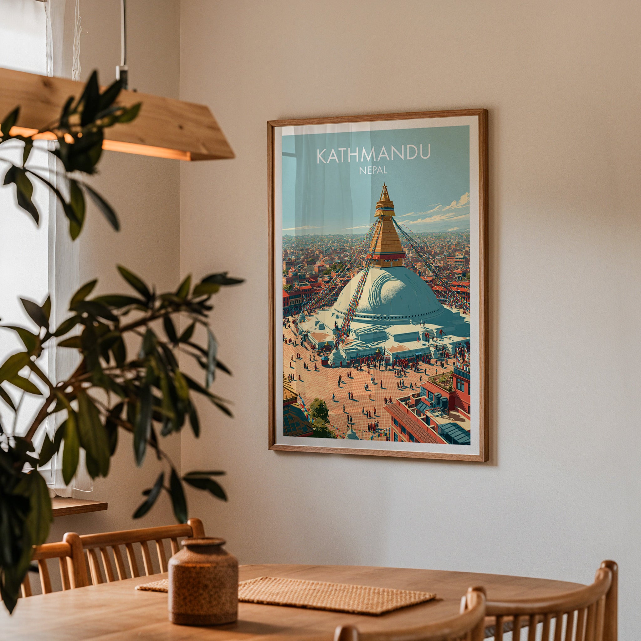 Framed Kathmandu Nepal print on a dining room wall above an oak table in warm afternoon light