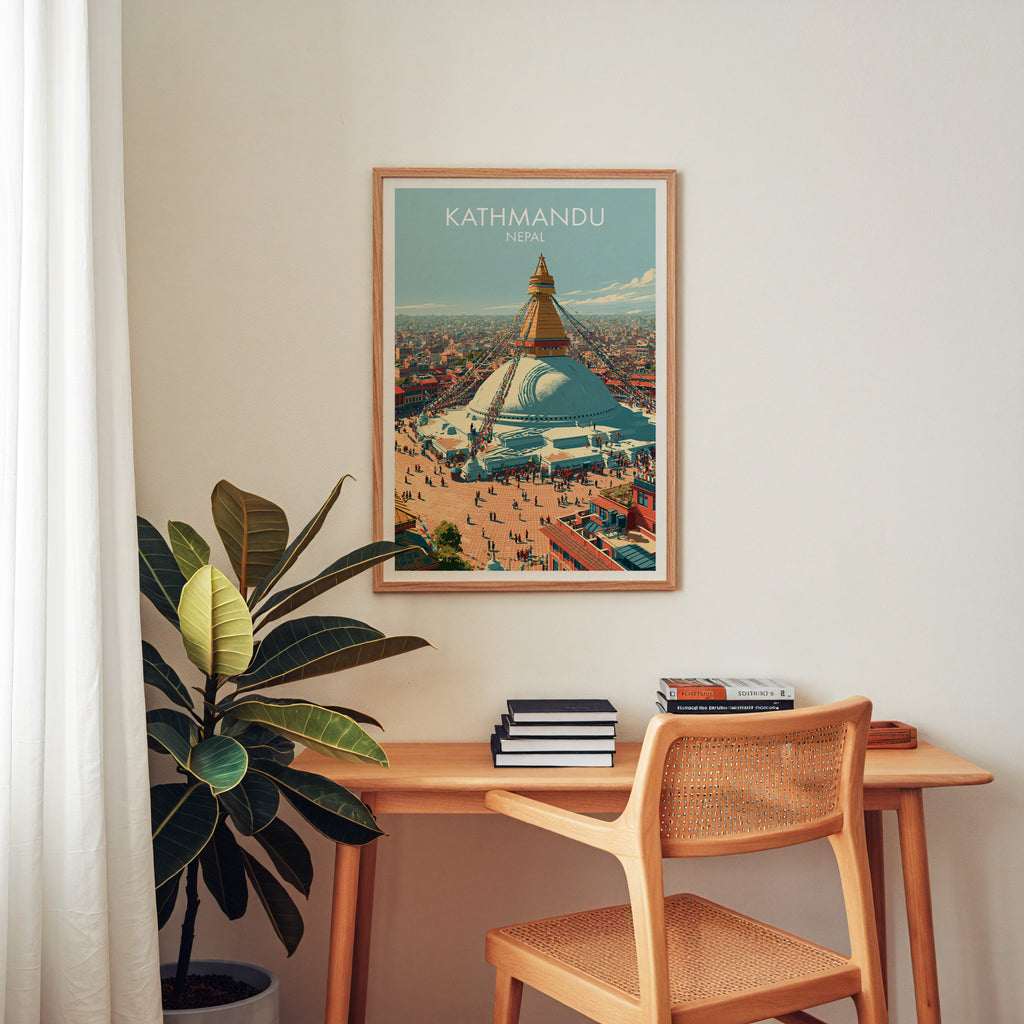 Kathmandu Nepal wall art above a wooden home office desk with a rattan chair and books