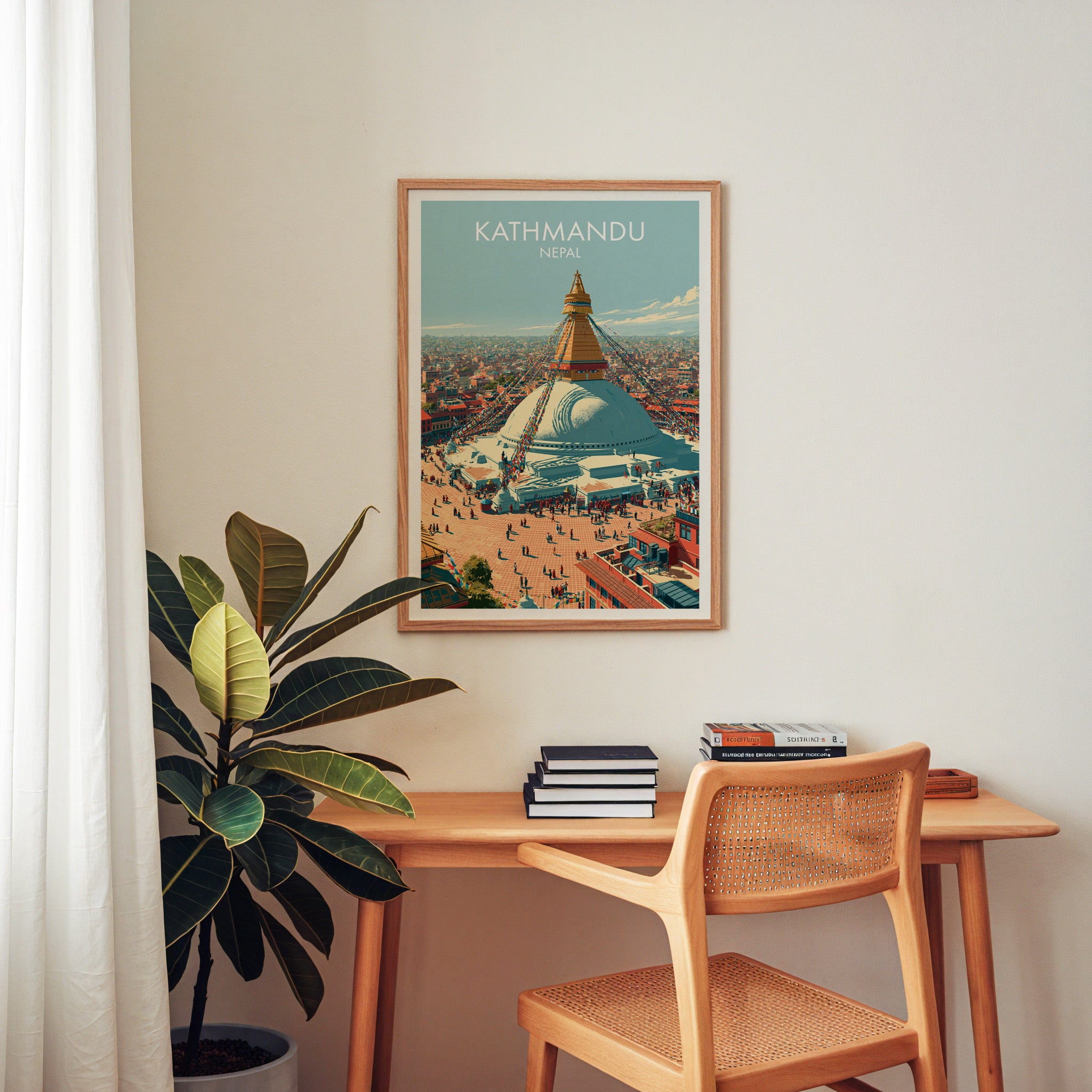 Kathmandu Nepal wall art above a wooden home office desk with a rattan chair and books