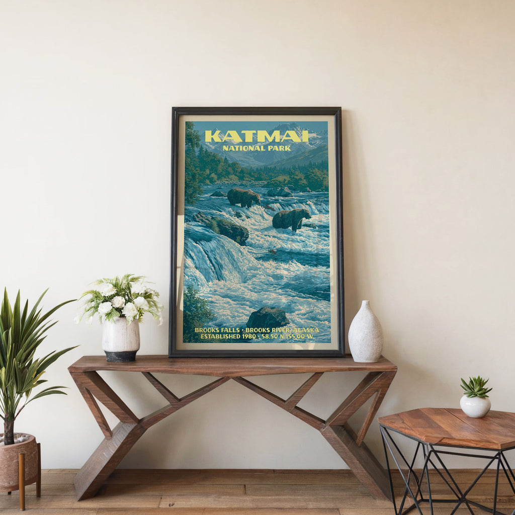 Katmai Brooks Falls wall art in black, leaning on a walnut console with white anemones and a vase