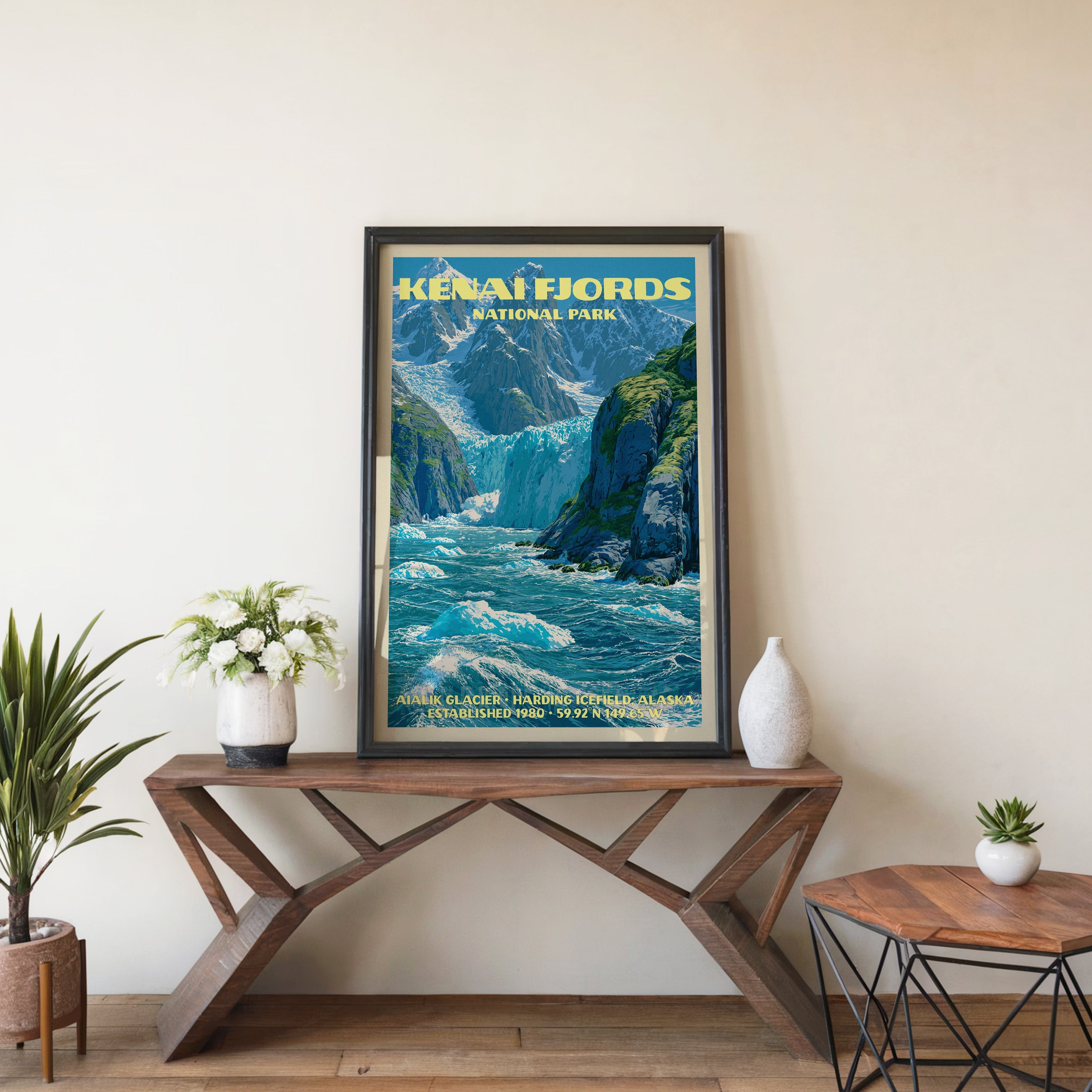 Kenai Fjords Aialik Glacier wall art in black, leaning on a walnut console with white anemones and a vase