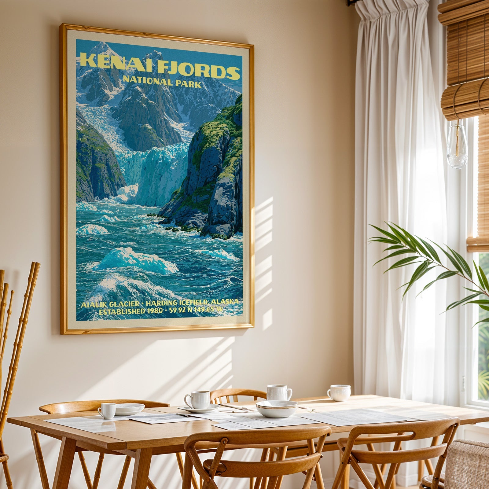 Kenai Fjords National Park print in gold above a light oak dining table by a curtained window