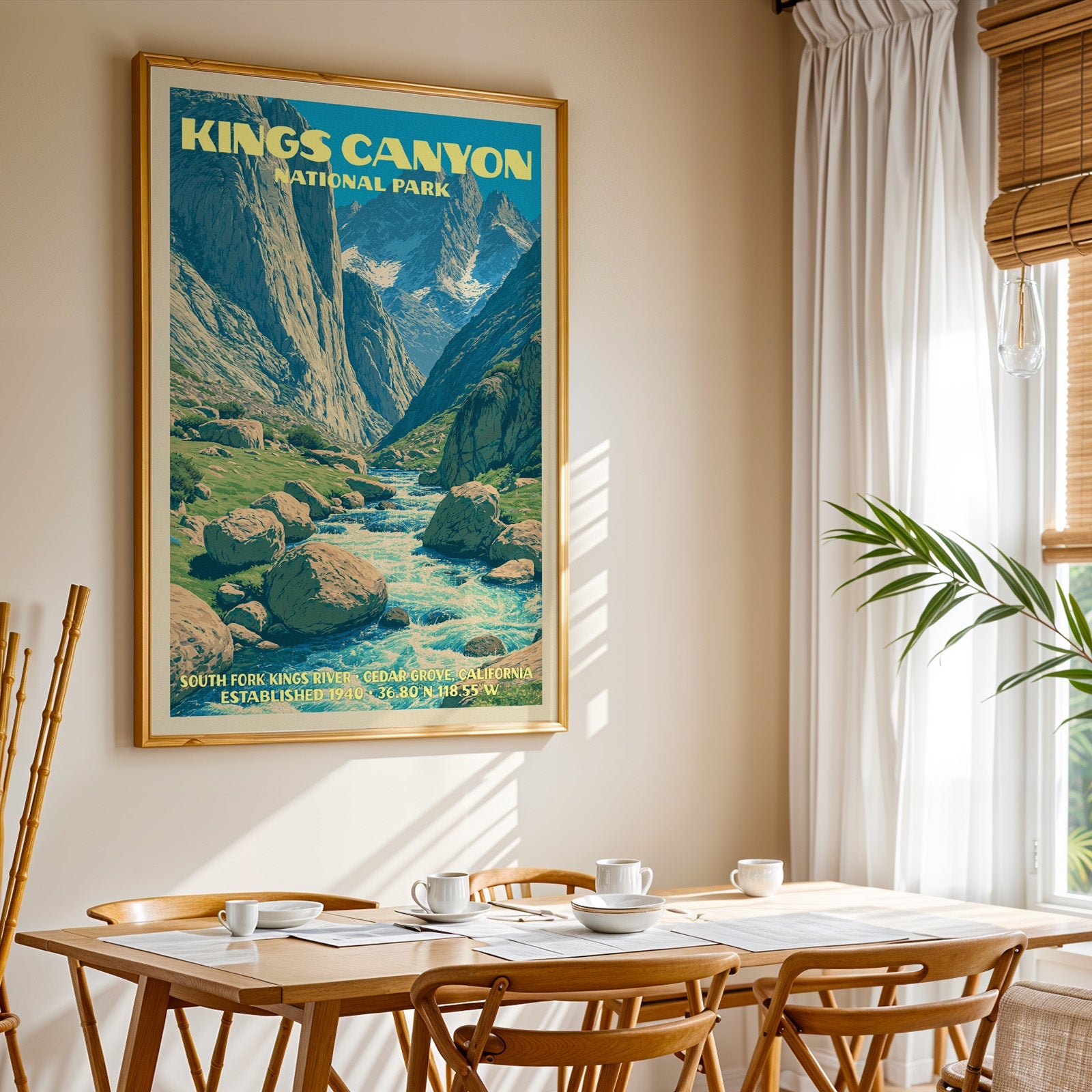 Kings Canyon National Park print in gold above a light oak dining table by a curtained window