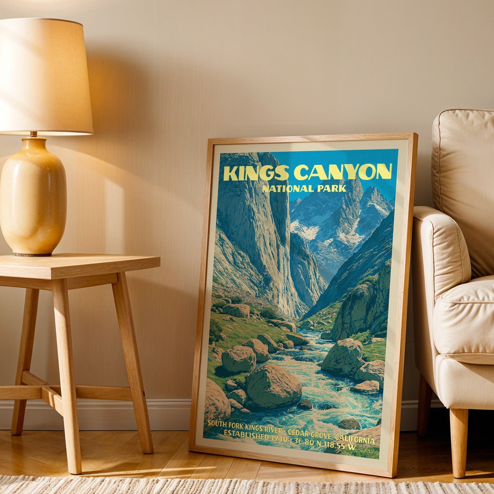 South Fork Kings River wall art in oak, leaning by an armchair and a side table with an ochre lamp