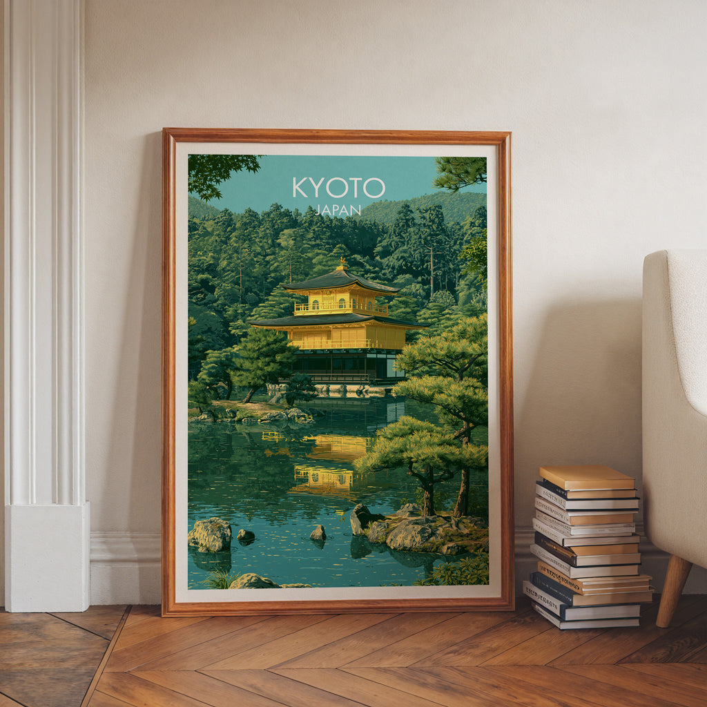 Kinkakuji Golden Pavilion Kyoto art print in a walnut frame leaning in a hallway beside stacked books