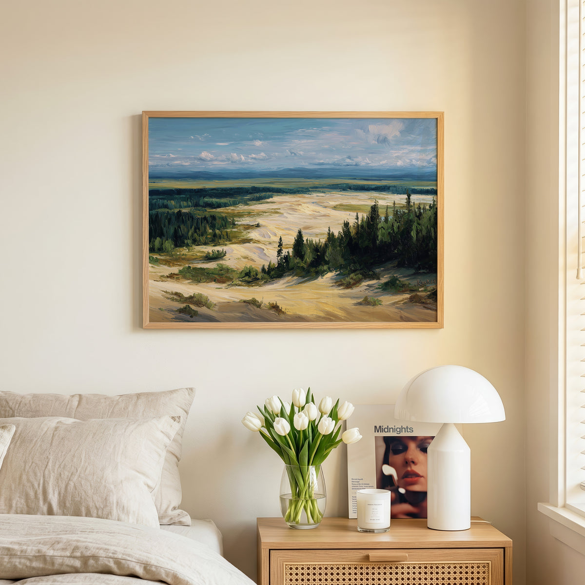 Kobuk Valley oil painting print in an oak frame leaning against a wall beside books