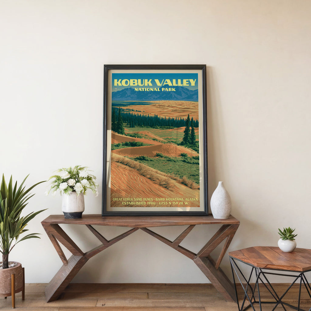 Kobuk Valley sand dunes wall art in black, leaning on a walnut console with white anemones and a vase