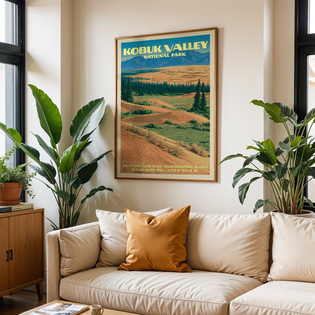 Kobuk Valley vintage travel print in oak above a cream sofa with a rust cushion and tall houseplants