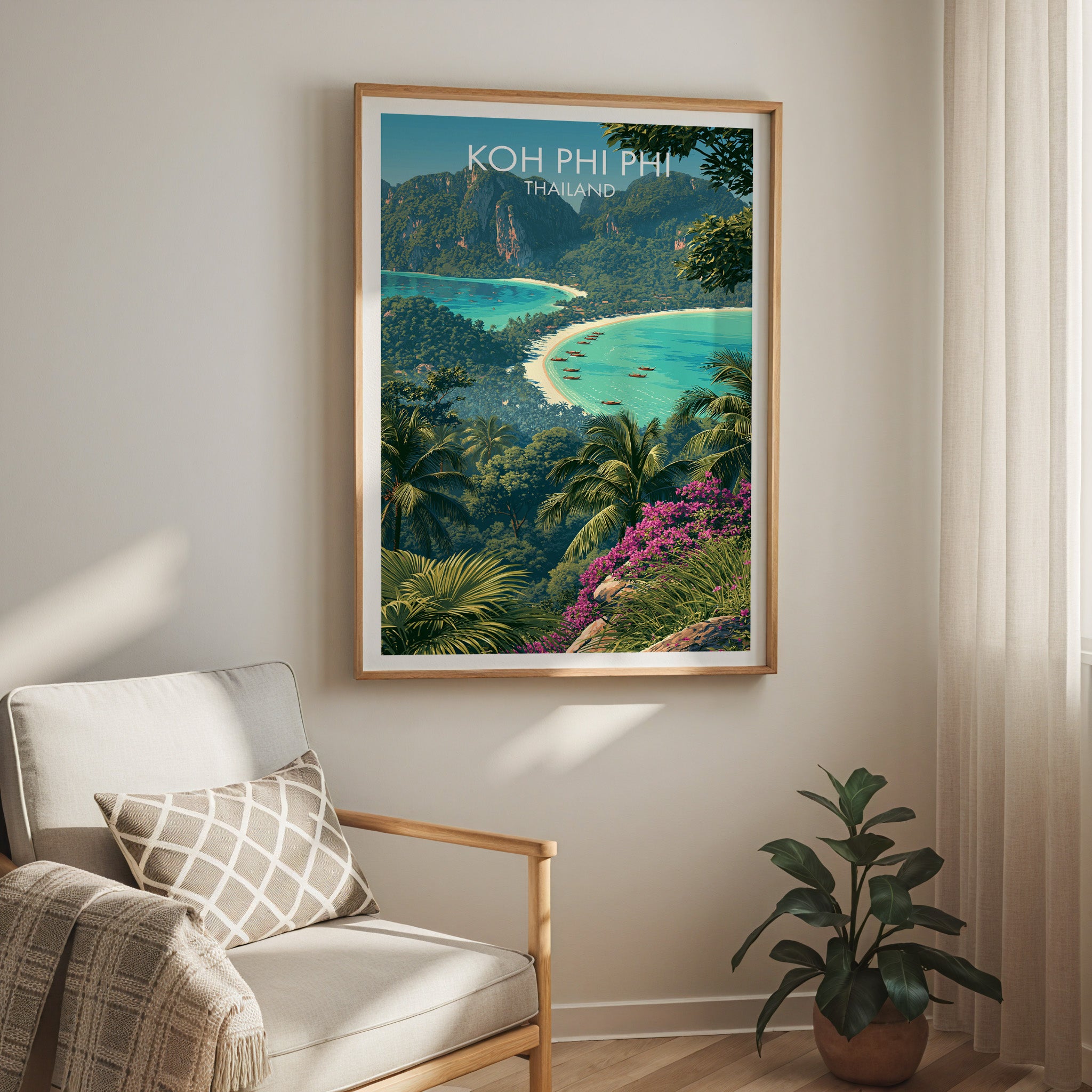 Koh Phi Phi Thailand travel print in a light oak frame on a living room wall beside a linen armchair