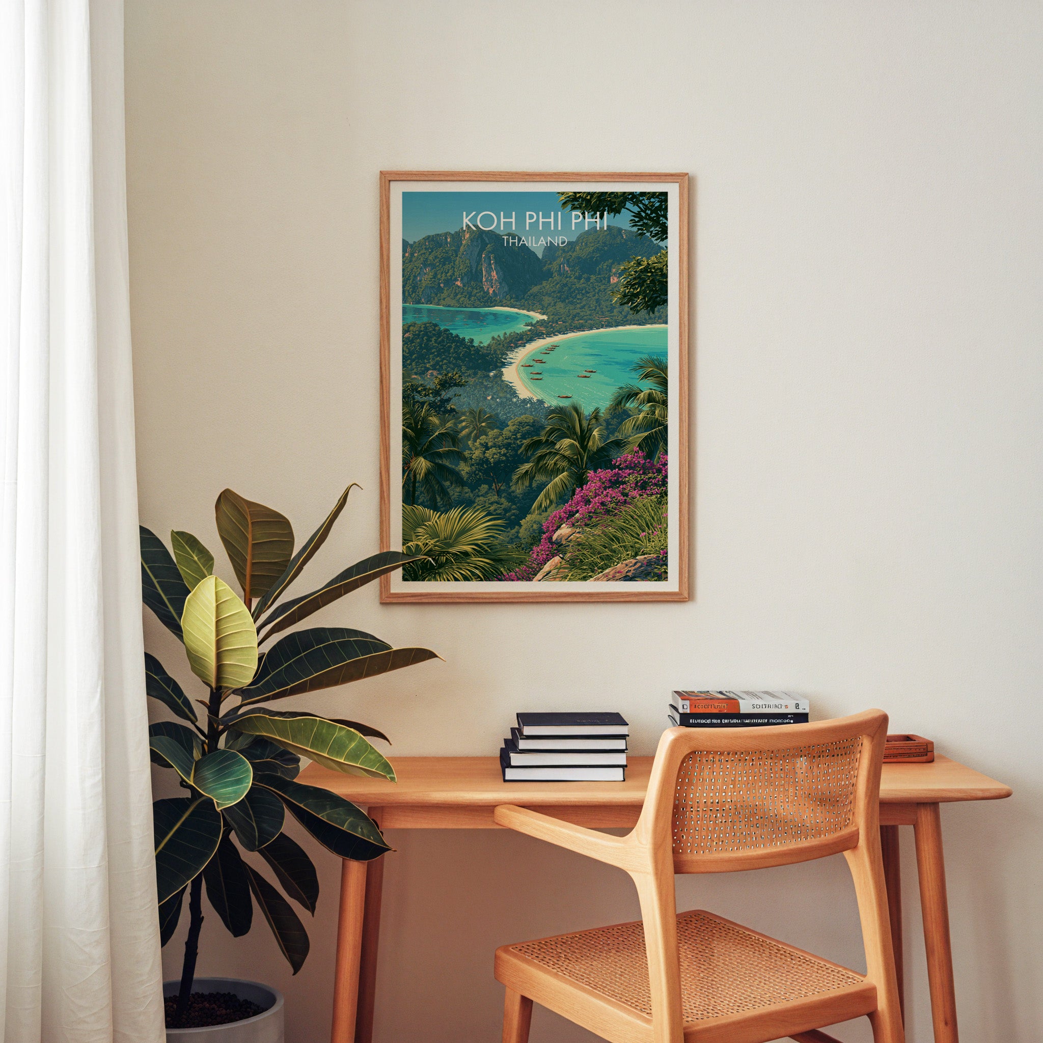Koh Phi Phi Thailand wall art above a wooden home office desk with a rattan chair and books