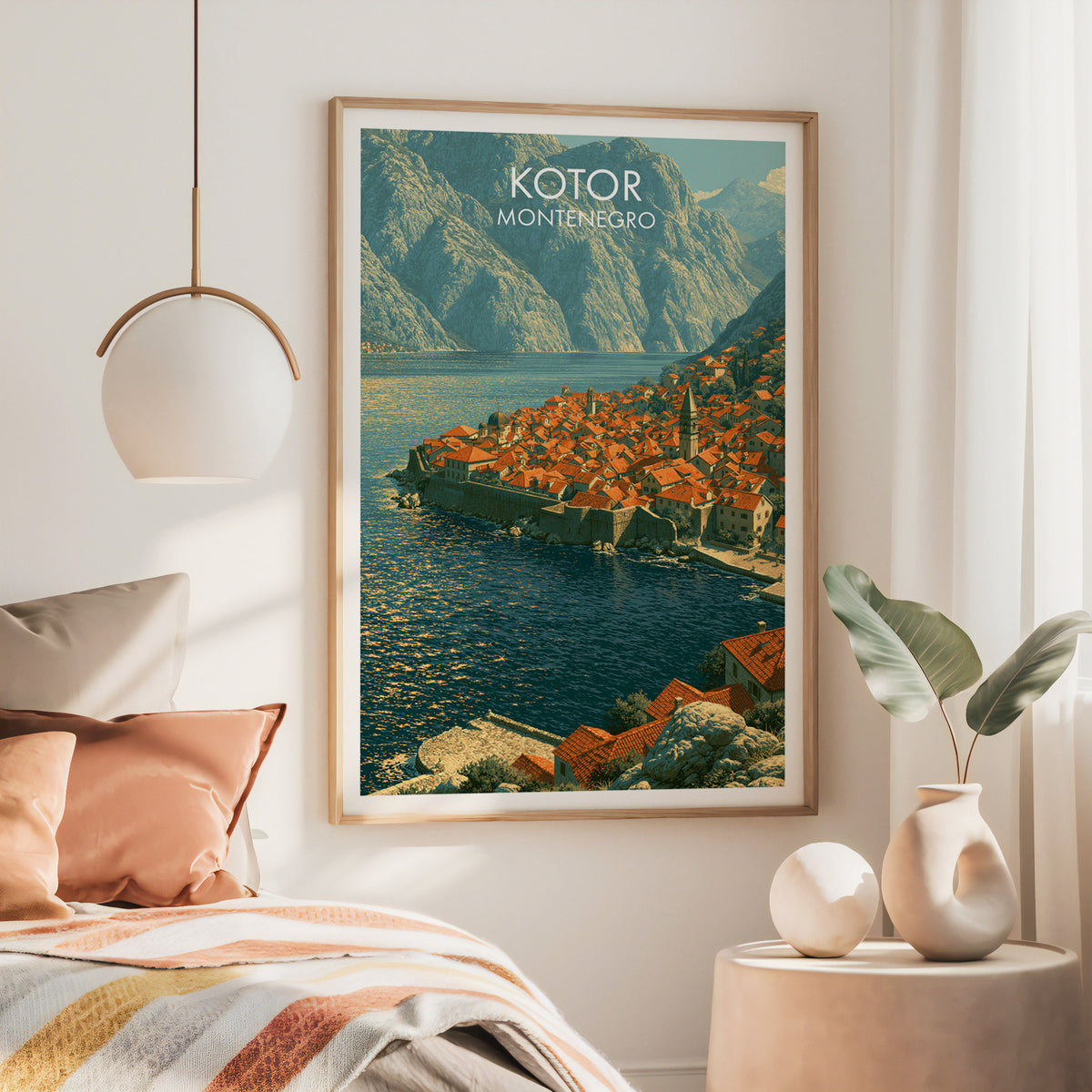 Montenegro coastal wall art, large oak frame above a bed with rust bedding and a brass globe pendant