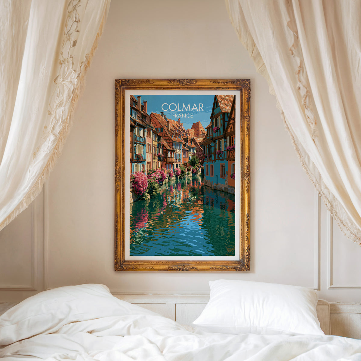 Colmar travel poster, ornate gold frame above a white bed with linen canopy curtains