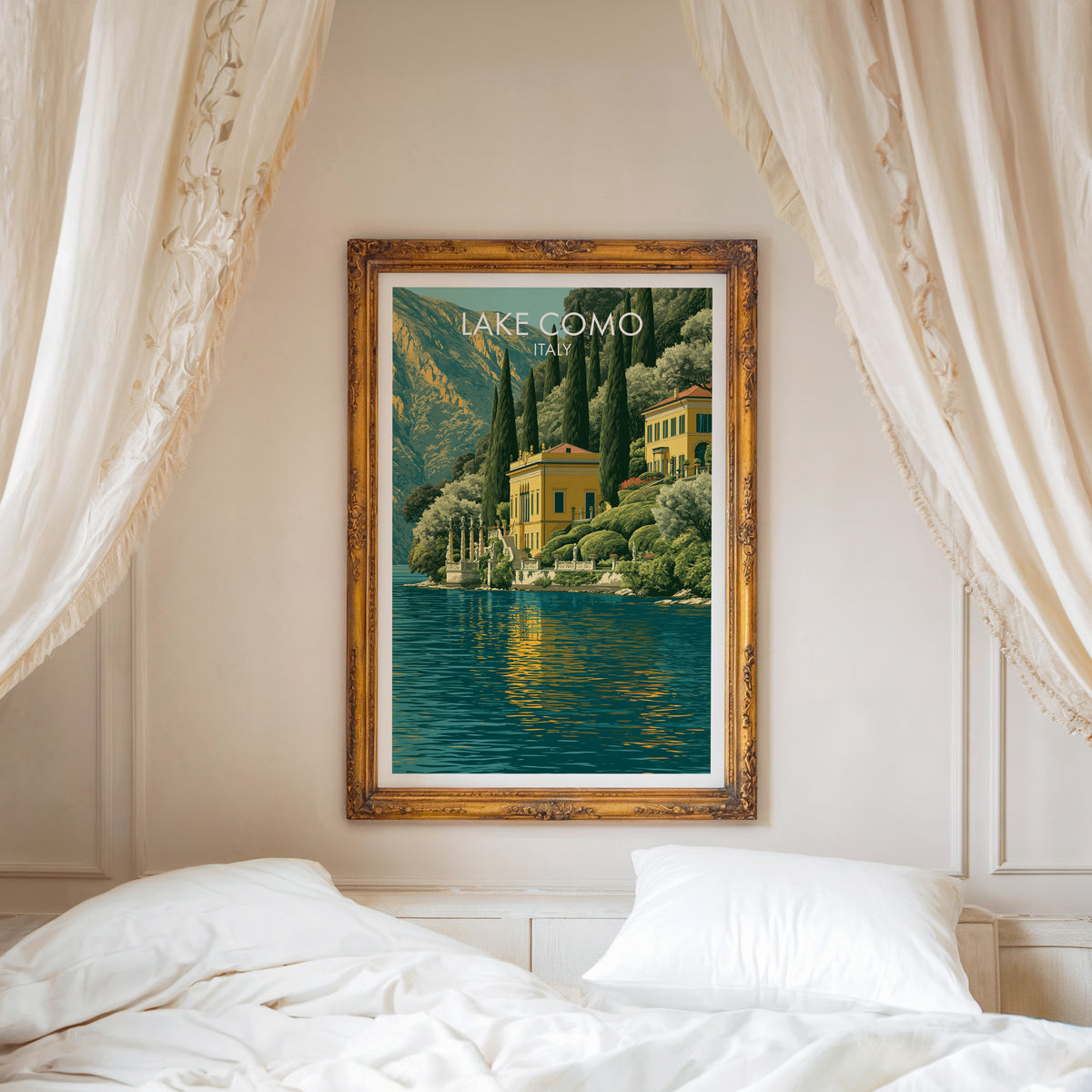 Lake Como villa print in an ornate gold frame above a white bed with linen canopy curtains