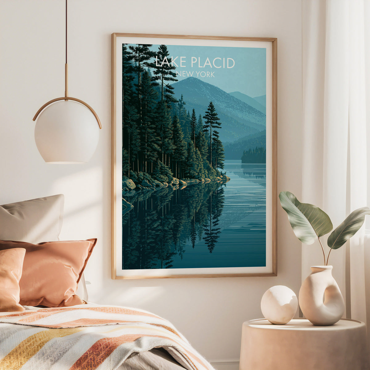 Large oak framed Lake Placid poster above a bed with rust bedding and a brass pendant lamp