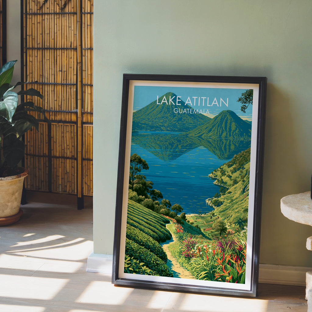 Terraced green fields and blue lake, black frame leaning on pale wood floor against a sage wall with a bamboo screen