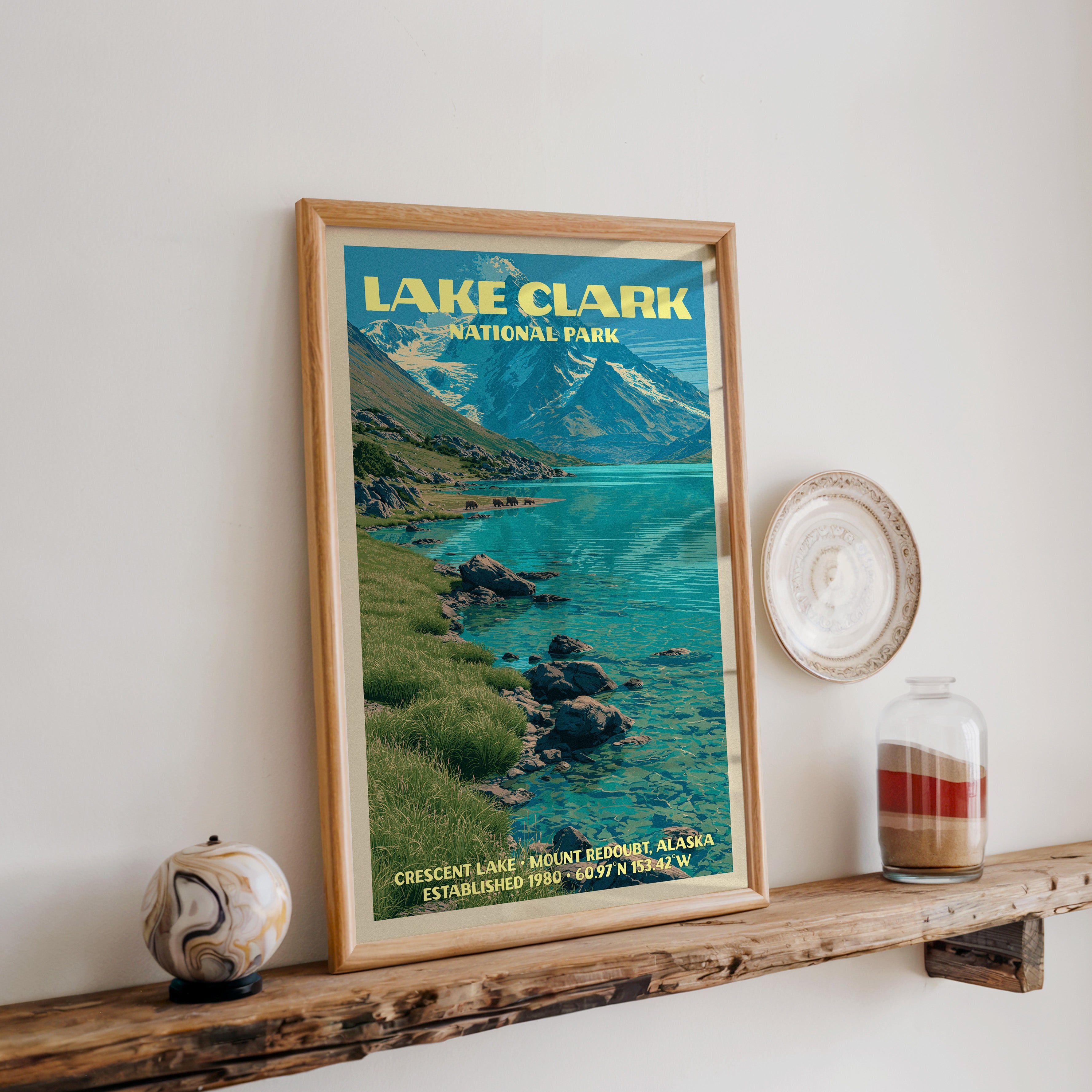 Lake Clark Crescent Lake print in oak, leaning on a reclaimed wood ledge with a marbled sphere and sand jar