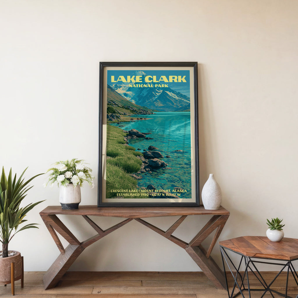 Lake Clark Crescent Lake wall art in black, leaning on a walnut console with white anemones and a vase