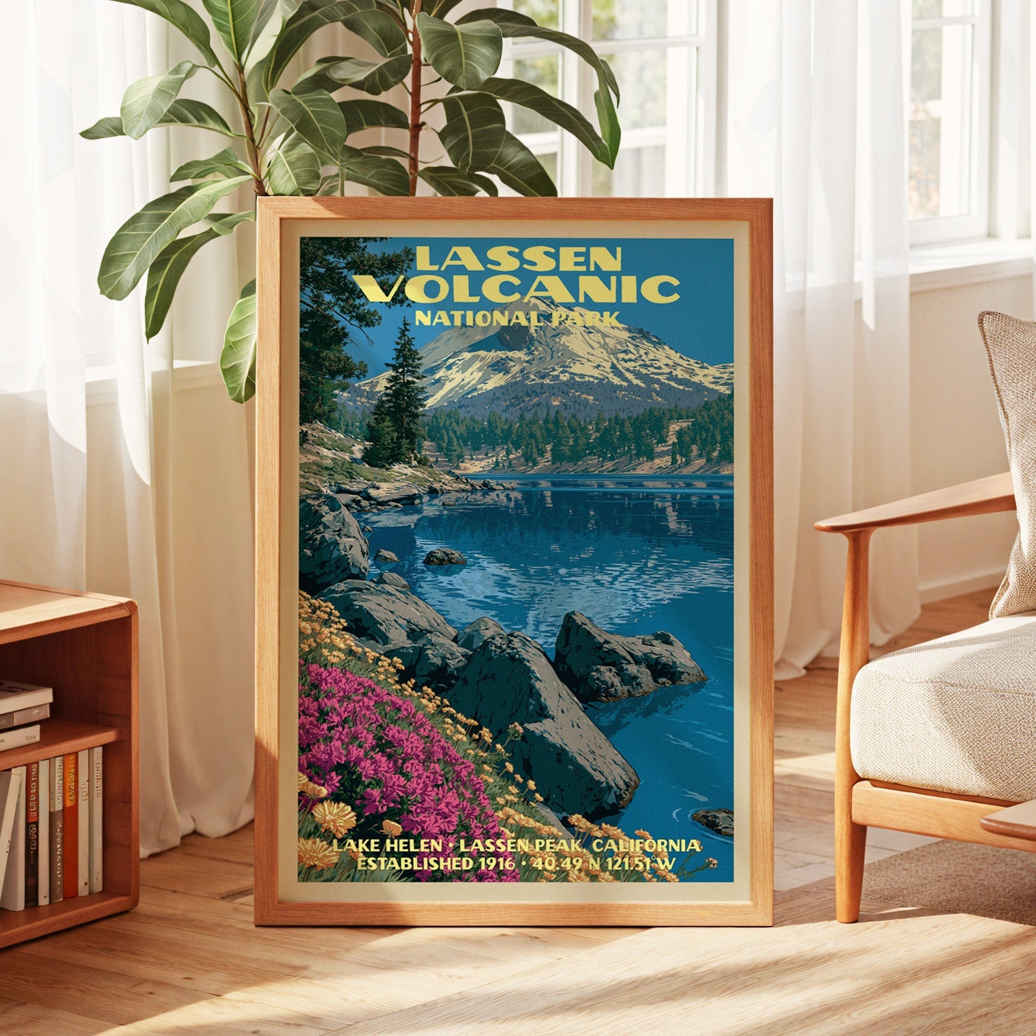 Lassen Volcanic vintage poster in oak, leaning by a sunlit window with sheer curtains and a low bookshelf