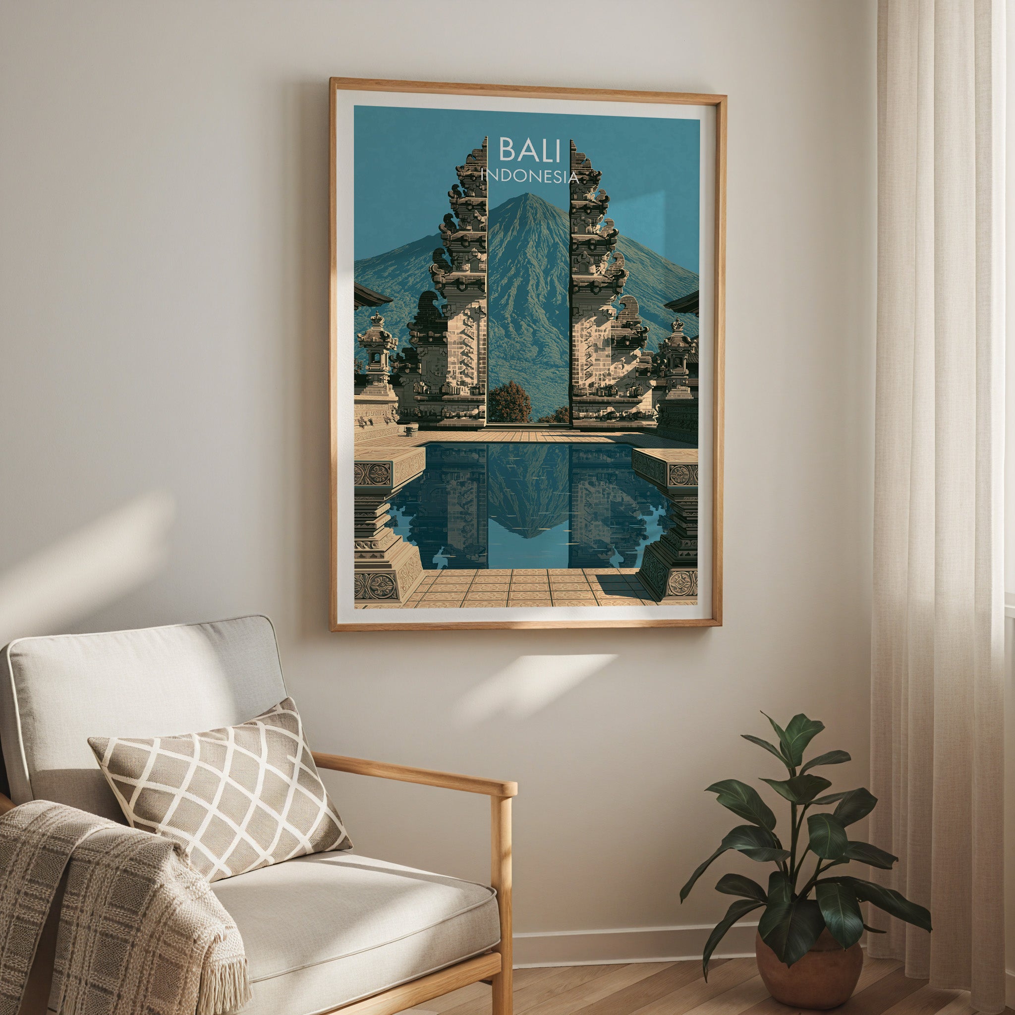 Lempuyang Temple Bali Indonesia travel print in a light oak frame on a living room wall beside a linen armchair