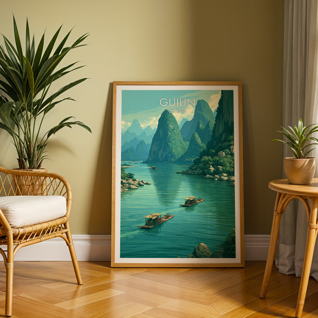 Large Li River Guilin China travel print in an oak frame leaning on a herringbone floor next to a rattan chair