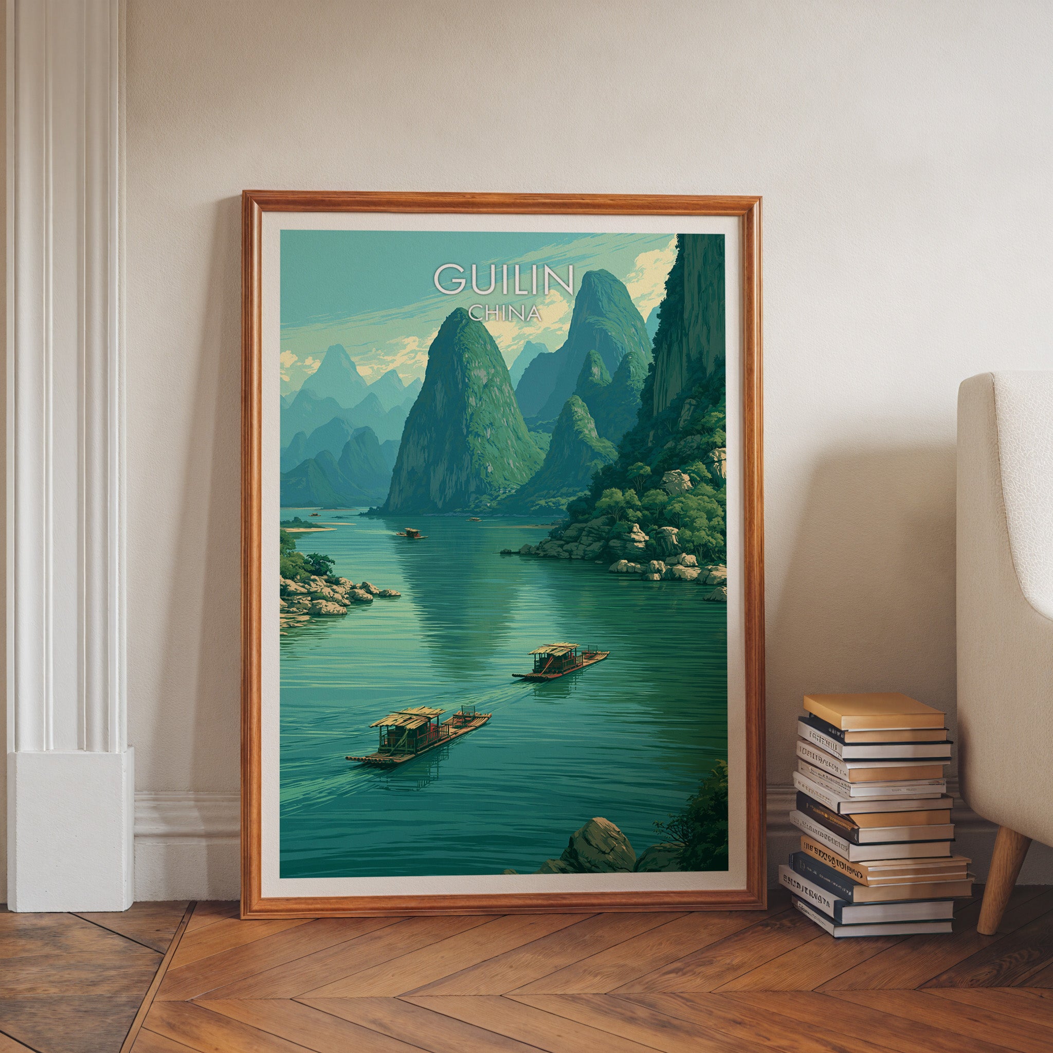 Li River Guilin China art print in a walnut frame leaning in a hallway beside stacked books