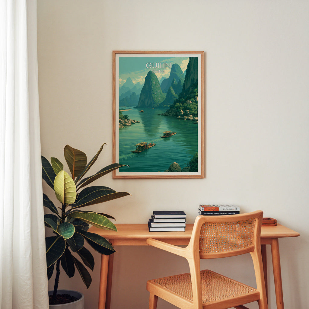 Li River Guilin China wall art above a wooden home office desk with a rattan chair and books