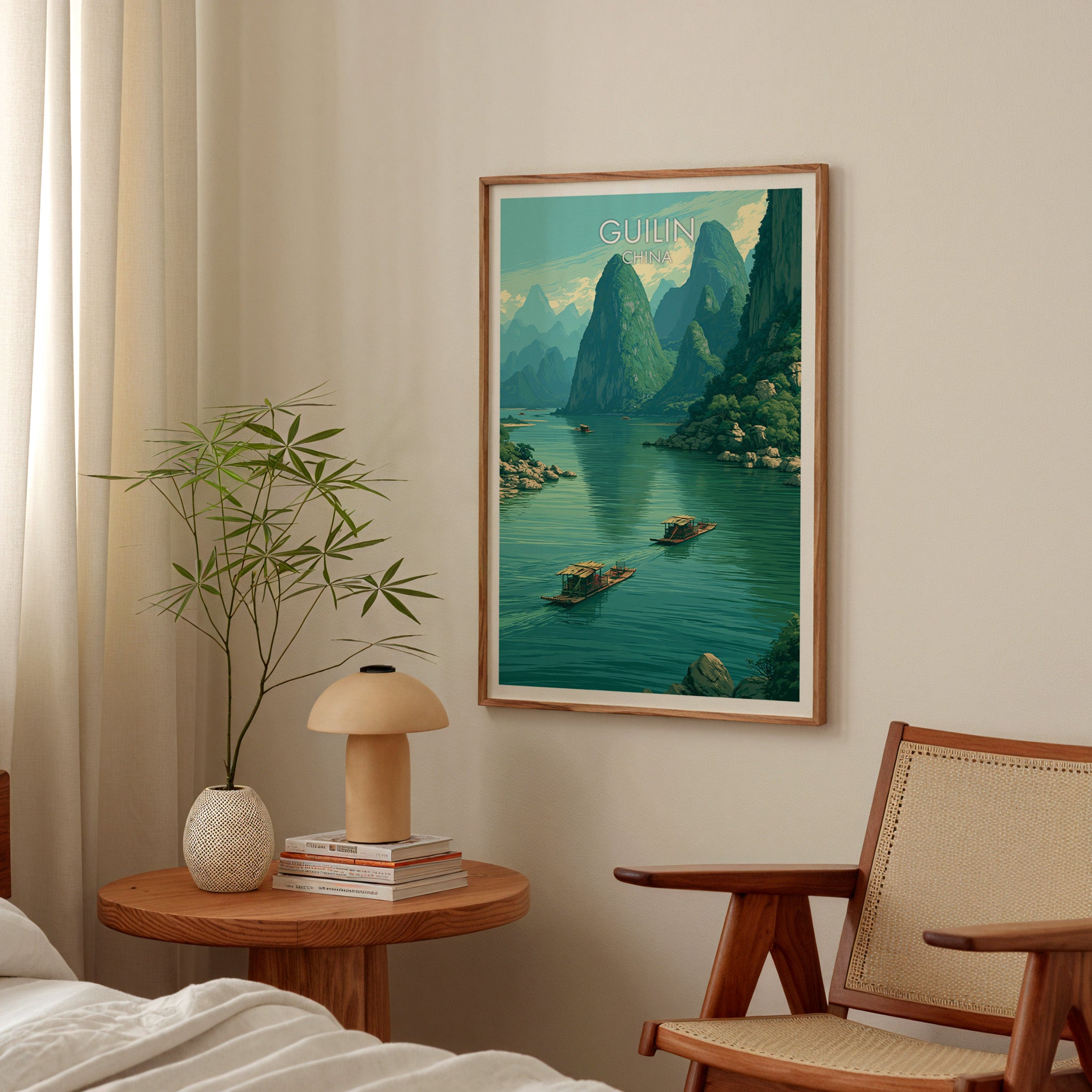 Li River Guilin China poster above a bedroom nightstand with a bamboo plant and mushroom lamp
