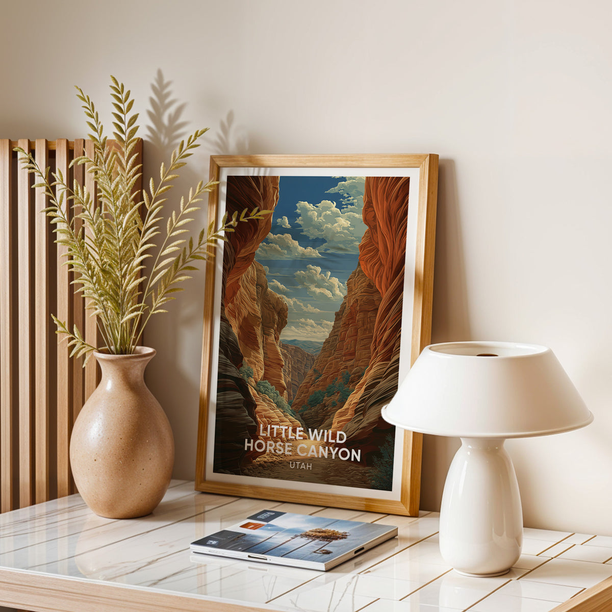 Little Wild Horse Canyon wall art in oak on a stone table with a speckled vase and a white dome lamp.