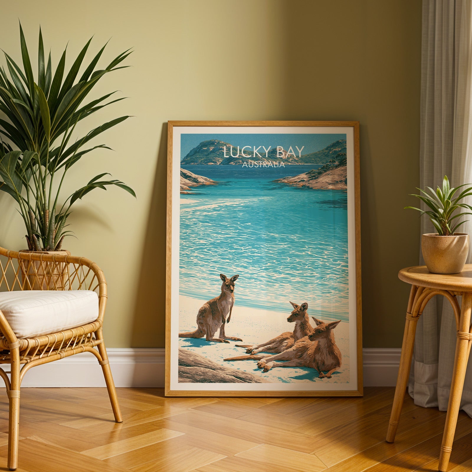 Western Australia bay poster in an oak frame on herringbone parquet with an olive wall and rattan chair