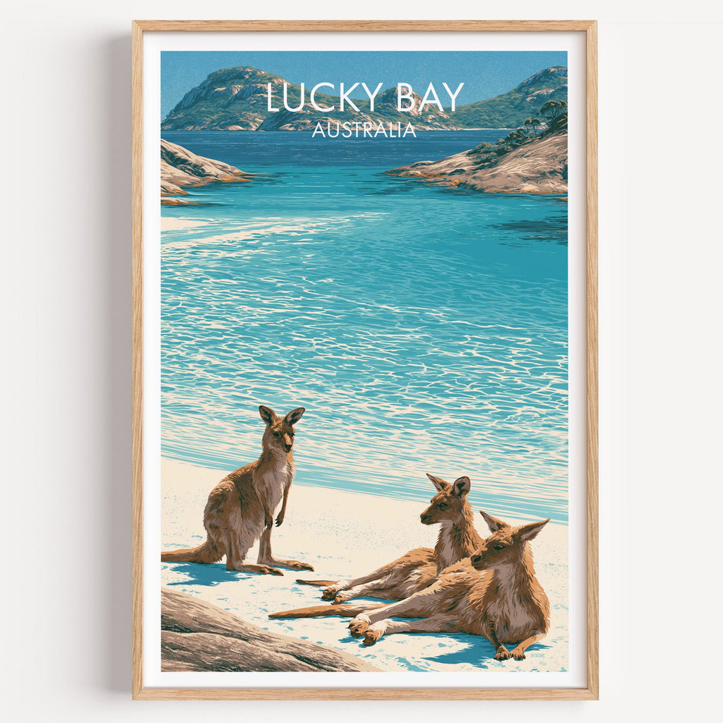 Lucky Bay kangaroo travel poster in a light oak frame on a plain white wall
