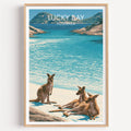 Lucky Bay kangaroo travel poster in a light oak frame on a plain white wall