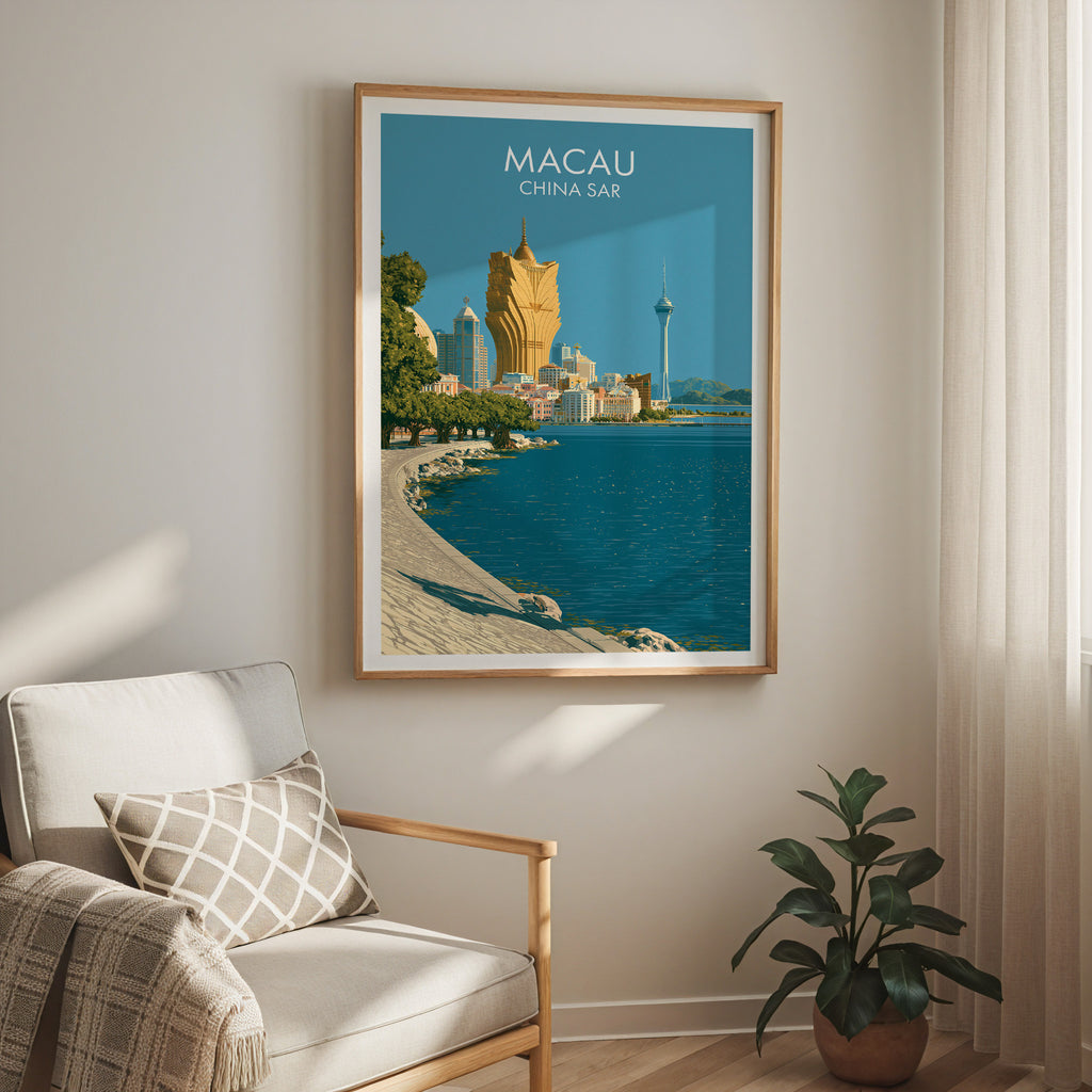 Macau China travel print in a light oak frame on a living room wall beside a linen armchair