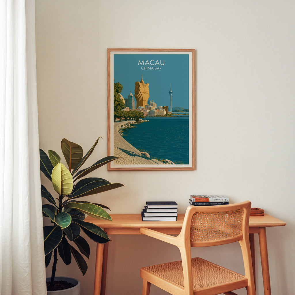 Macau China wall art above a wooden home office desk with a rattan chair and books