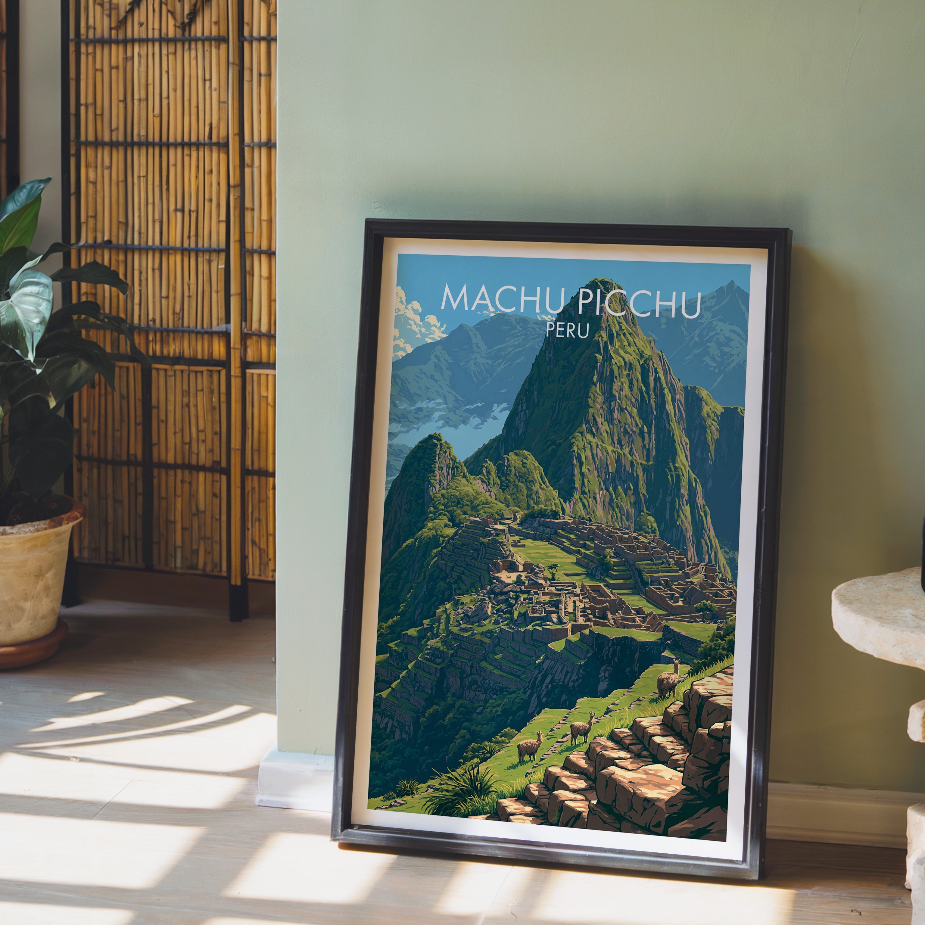 Andes terraces print in a dark brown frame on a sage green wall with a bamboo screen and potted plant