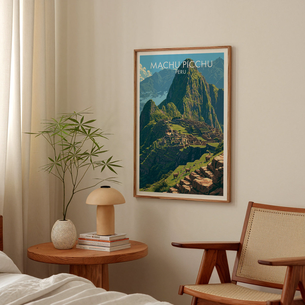 Inca ruins wall art in a walnut frame over a round bedside table with a terracotta lamp and bamboo stems