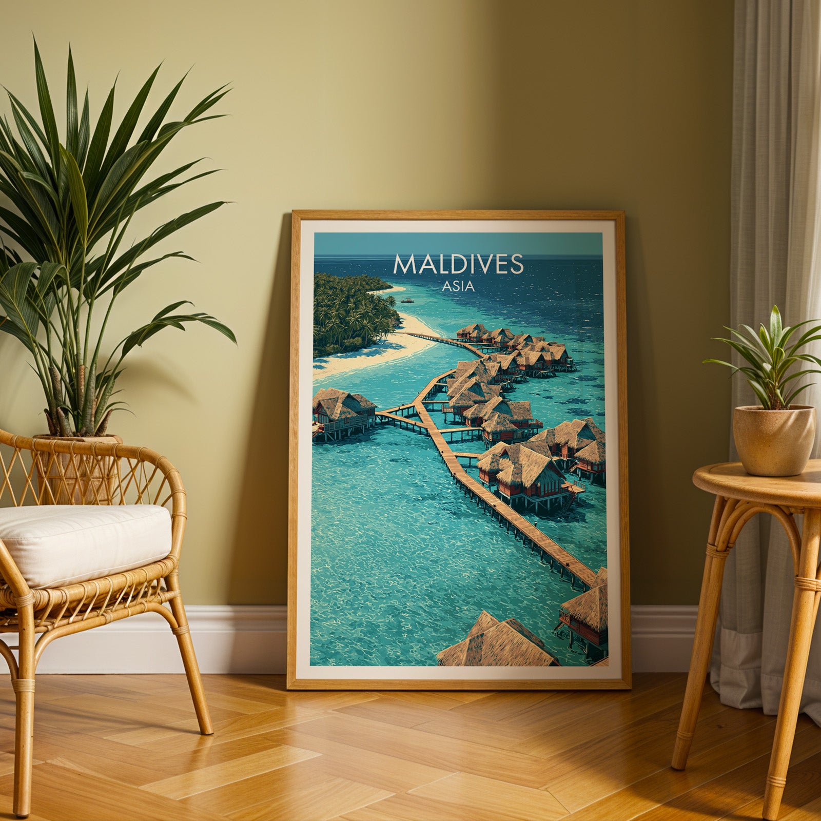 Large Maldives travel print in an oak frame leaning on a herringbone floor next to a rattan chair