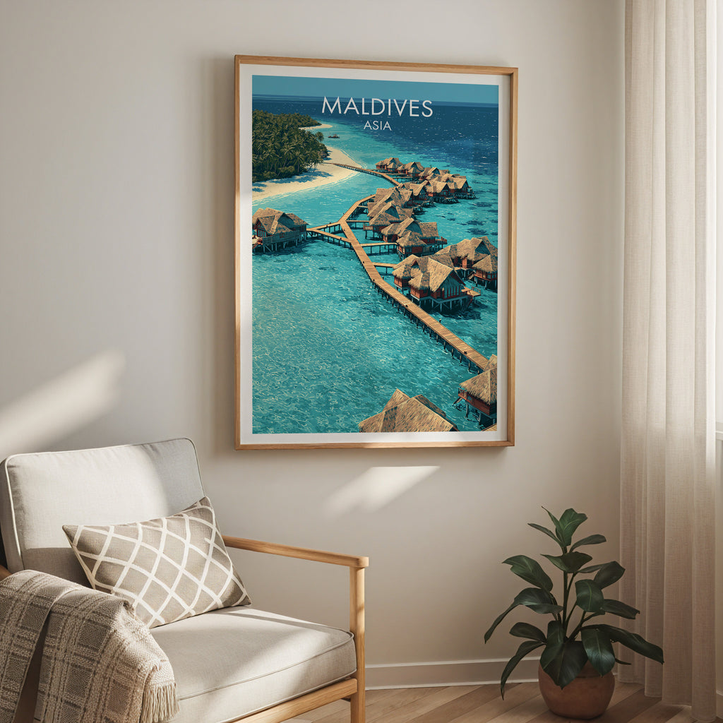 Maldives travel print in a light oak frame on a living room wall beside a linen armchair