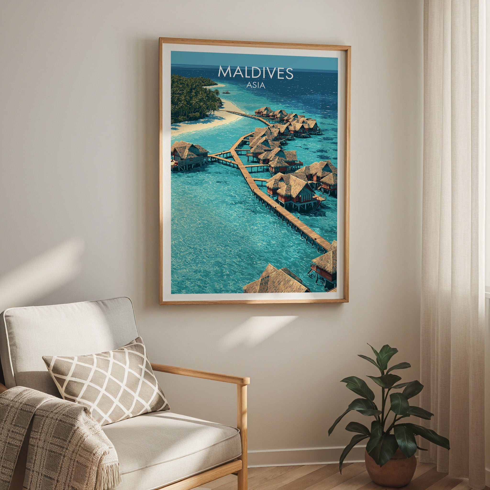 Maldives travel print in a light oak frame on a living room wall beside a linen armchair