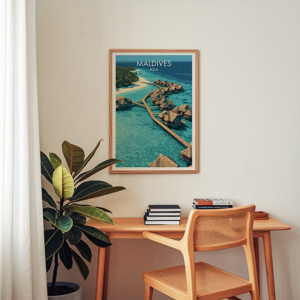 Maldives wall art above a wooden home office desk with a rattan chair and books