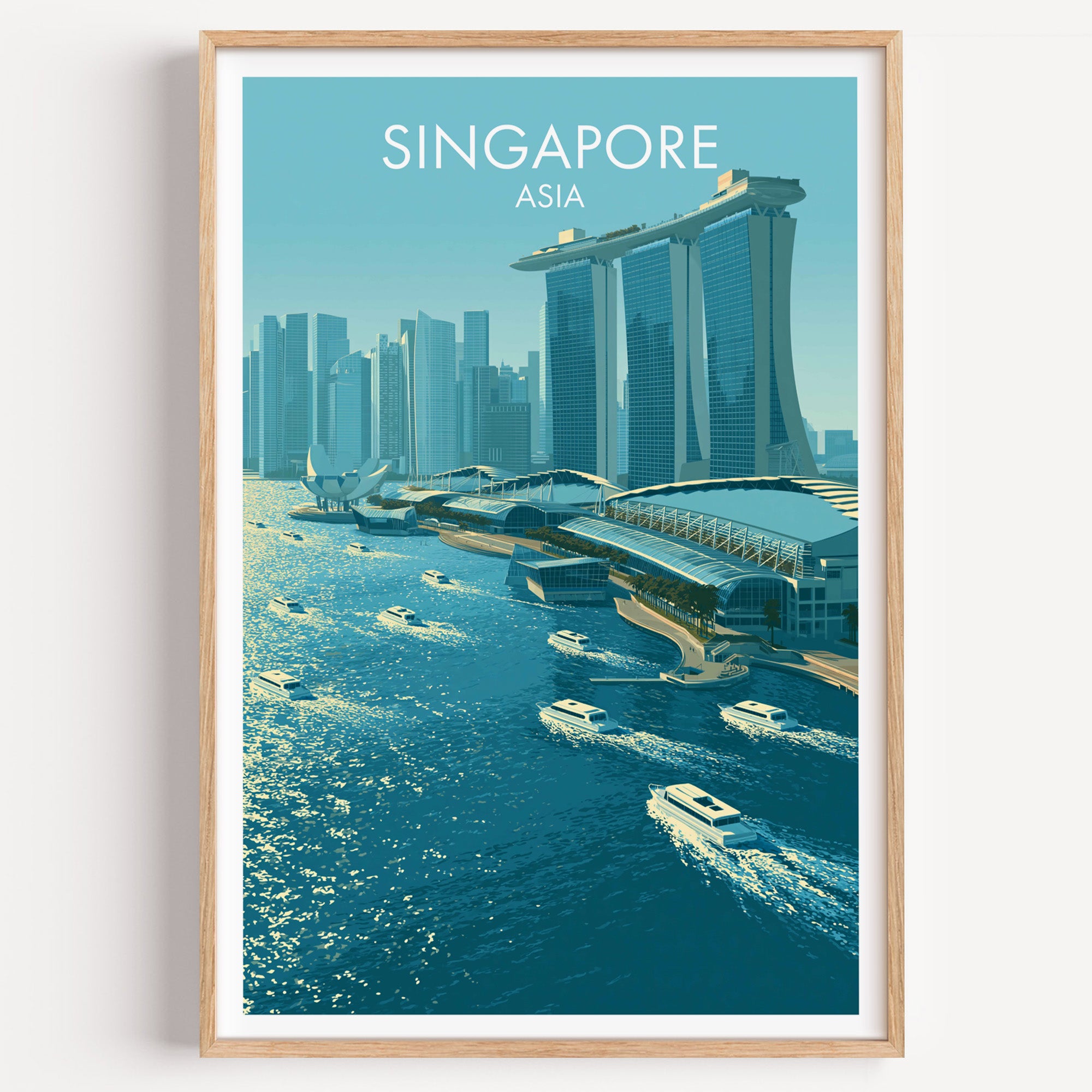 Marina Bay Sands Singapore travel poster in a natural wood frame, shown against a clean white wall