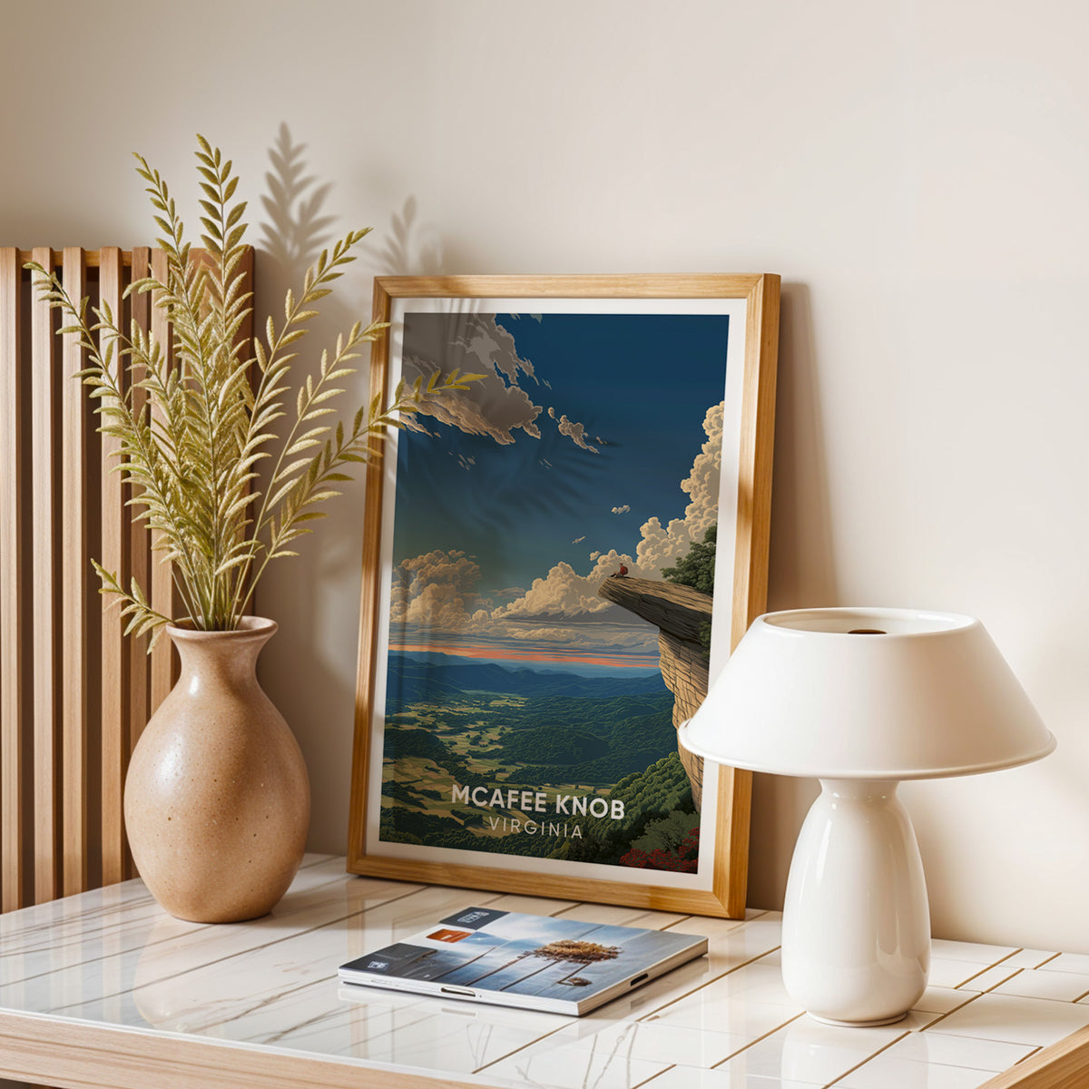 Catawba Valley overlook print in oak on a stone table with a white lamp, dried leaves and magazines