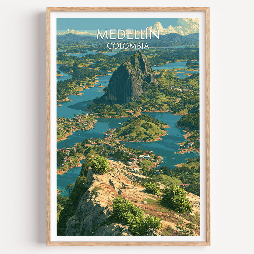 Medellin Colombia travel print of the Guatape rock above a teal lake in a light oak frame on a white wall