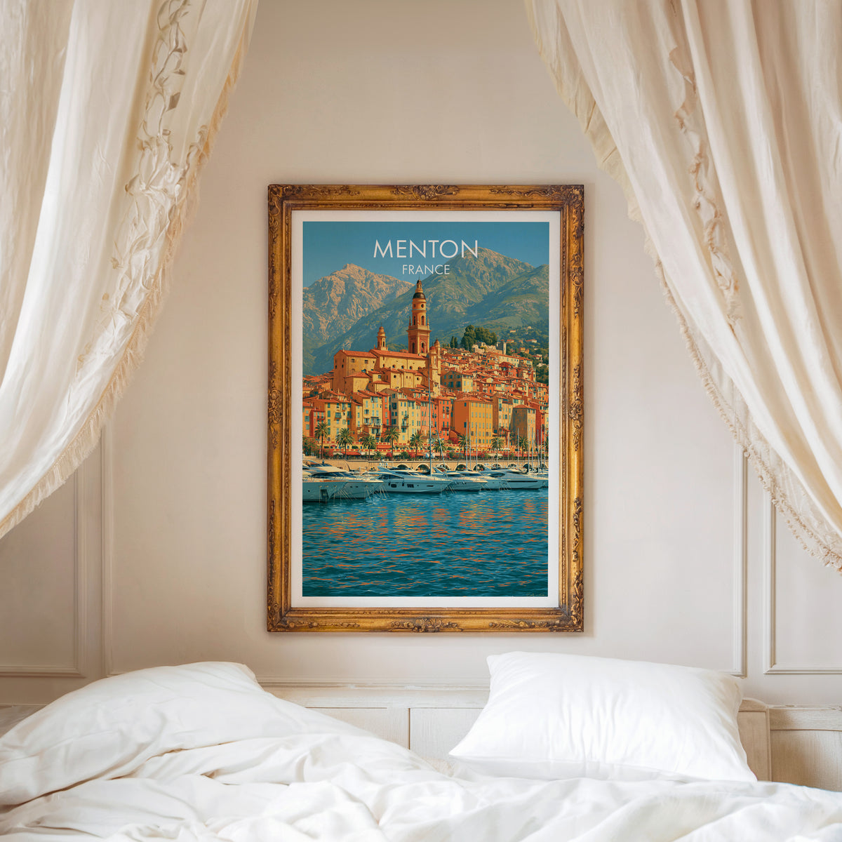 Menton travel poster, ornate gold frame above a white bed with linen canopy curtains