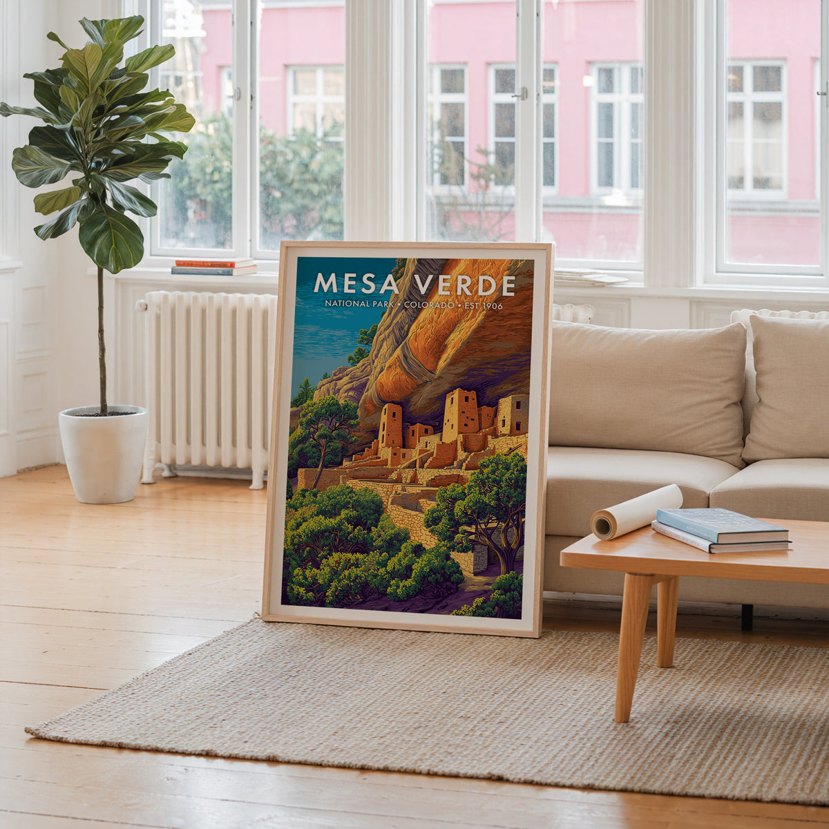 Mesa Verde National Park mid-century modern art print propped in a neutral living room behind a low oak coffee table — living room wall art