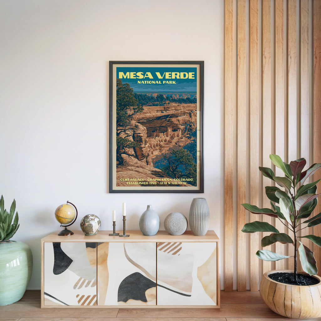 Mesa Verde National Park poster in a black frame above a light wood sideboard by a slatted wall panel